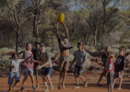 An image of a group of Australian kids playing a field game